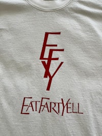 a white t - shirt with the word eat fartyll on it